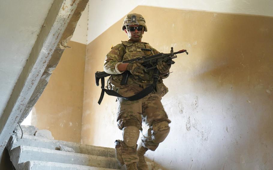 A U.S. soldier of 2nd Squadron, 2nd Cavalry Regiment, makes his way down the stairs at the conclusion of the squadron?s room breaching and clearing exercise during Agile Spirit 19 near Tbilisi, Georgia, July 29, 2019.