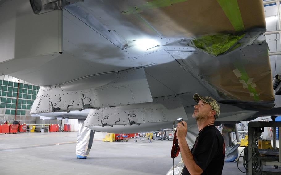Dale Benoit, 576th Aircraft Maintenance Squadron, inspects newly applied paint on a new A-10 Thunderbolt II wing at Hill Air Force Base, Utah, July 3, 2019. The aircraft was the last of 173 A-10s to receive new wings under the Enhanced Wing Assembly program.
