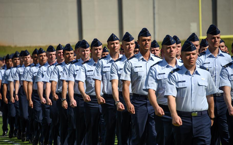 Newly minted officers from Air Force Officer Training School march during pass-and-review at their graduation ceremony in Montgomery, Ala., Sept. 27, 2019.