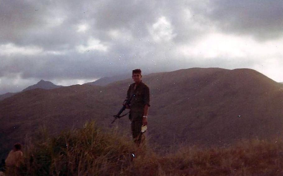 1st Lt. Michael McDonald-Low awaits the arrival of a helicopter on May 5, 1968, to take him and other soldiers to Hill 352, Nui Hoac Ridge, South Vietnam.