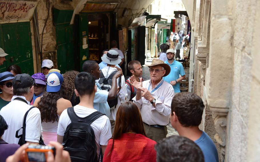 A tour group visits Jerusalem's Old City along the Via Dolorosa. U.S. European Command said Monday, Dec. 2, 2019,  it has lifted an order restricting travel there, but American military personnel are still prohibited from visiting other parts of the West Bank, including Bethlehem and Jericho.