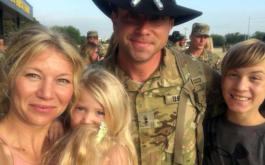Chief Warrant Officer 2 David Knadle, second from right, his wife Silkey, daughter Starling and son Eason Bertone reunite in Fort Hood, Texas, on July 1, 2018, after the Army pilot finished a rotation in Germany. Knadle, 33, died while on a mission on Nov. 20, 2019, in Afghanistan.