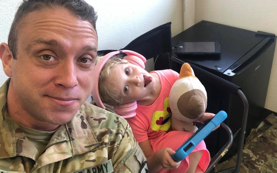 Chief Warrant Officer 2 David C. Knadle plays with his daughter, Starling, at his office in Fort Hood, Texas, in September of 2019, shortly before deploying to Afghanistan. Knadle, 33, died while on a mission on Nov. 20, 2019, in Afghanistan.