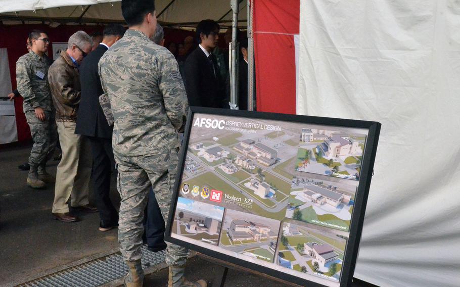 An illustration of facilities for Air Force CV-22 Osprey aircraft is displayed during a groundbreaking ceremony at Yokota Air Base, Japan, Thursday, Dec. 5, 2019.