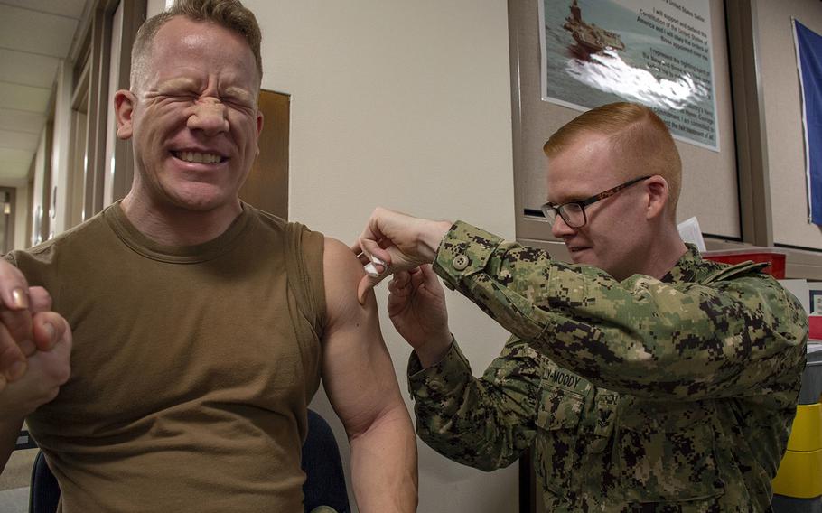 A sailor receives a flu vaccination at Naval Hospital Bremerton, Wash., Oct. 21, 2019, through coverage by Tricare.