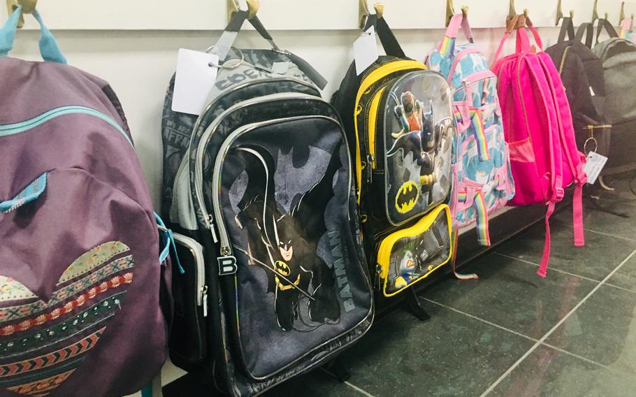 A row of backpacks hang in the hallway of the Bahrain School on September 5, 2019. The school was closed Monday Dec. 9, 2019, by order of the king following a big win by the Bahrain national soccer team.