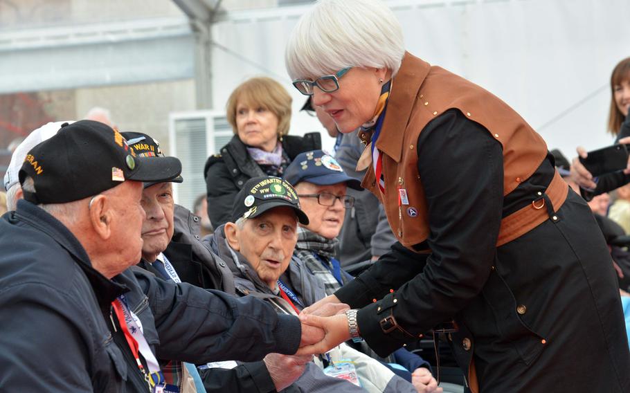 Helen Patton, granddaughter of Gen. George S. Patton, talks to Battle of the Bulge veterans before the commemorations at the Luxembourg American Cemetery marking the 75th anniversary of the battle, Monday, Dec. 16, 2019. The general is buried at the cemetery.