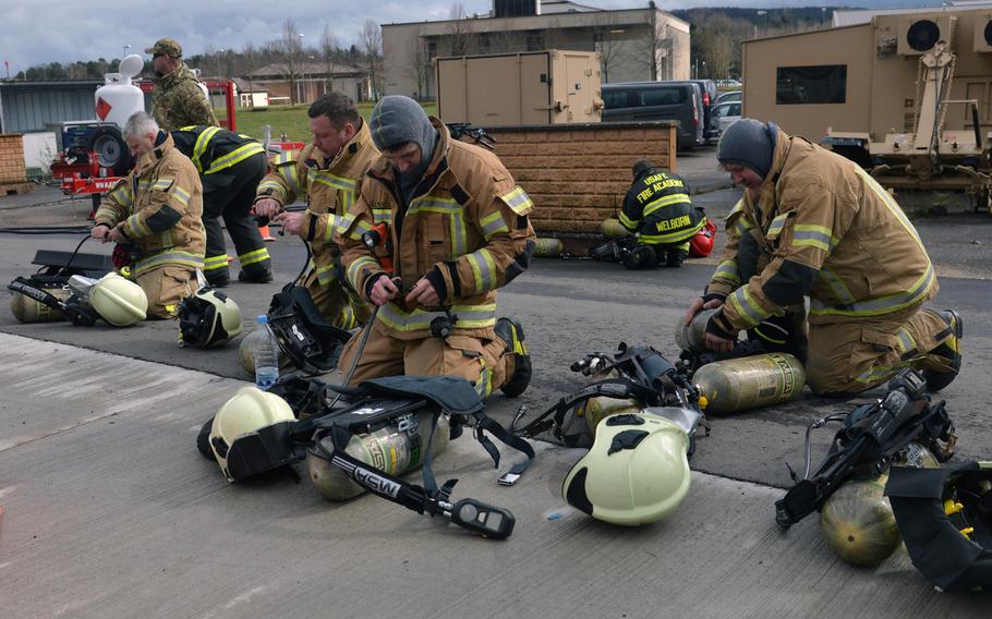 The Latvian firefighting team prepares to train at Ramstein Air Base, Germany, March 11, 2020. Firefighters from four NATO nations practiced putting out fires at the USAFE Fire Academy on the base.