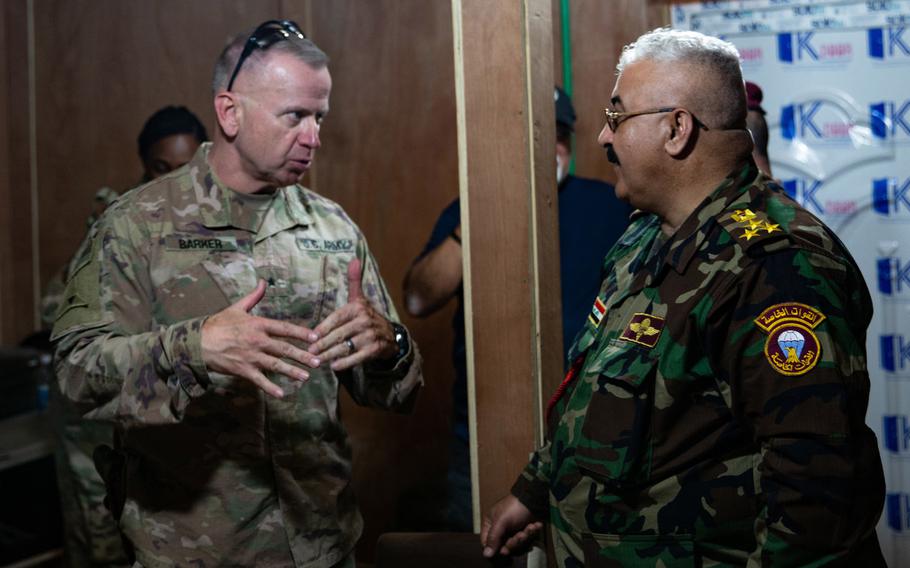 U.S. Army Brig. Gen. Vincent Barker, Combined Joint Task Force - Operation Inherent Resolve director of sustainment, speaks with Brig. Gen. Ali Abdalwahid Jassim at al-Qaim Base, Iraq, March 17, 2020. The base was turned over to the 8th Iraqi Army on Tuesday.