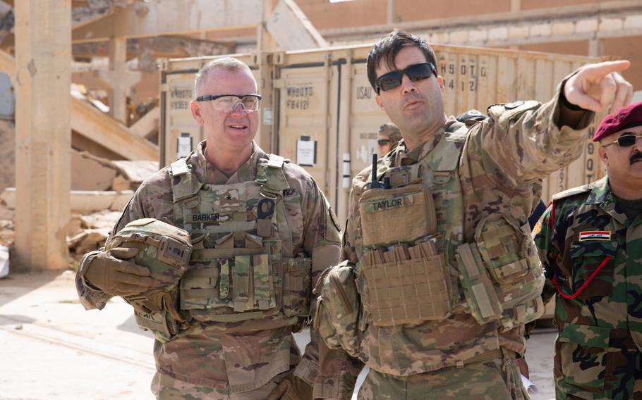 U.S. Army Maj. Luc Taylor, al-Qaim base commander, explains daily operations to Brig. Gen. Vincent Barker, Combined Joint Task Force - Operation Inherent Resolve  director of sustainment, at al-Qaim Base, Iraq, March 17, 2020. The base was turned over to the 8th Iraqi Army on Tuesday.