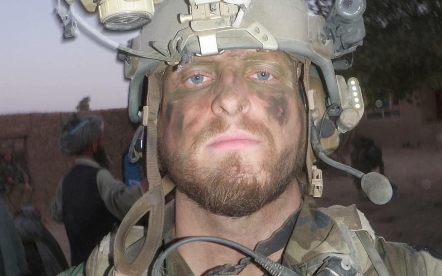 Kevin Flike, a Green Beret at the time, takes a selfie while on a patrol in in northern Afghanistan in 2011. Flike, 35, promised himself he would run a marathon after getting shot by a Taliban sniper in Afghanistan on that deployment.