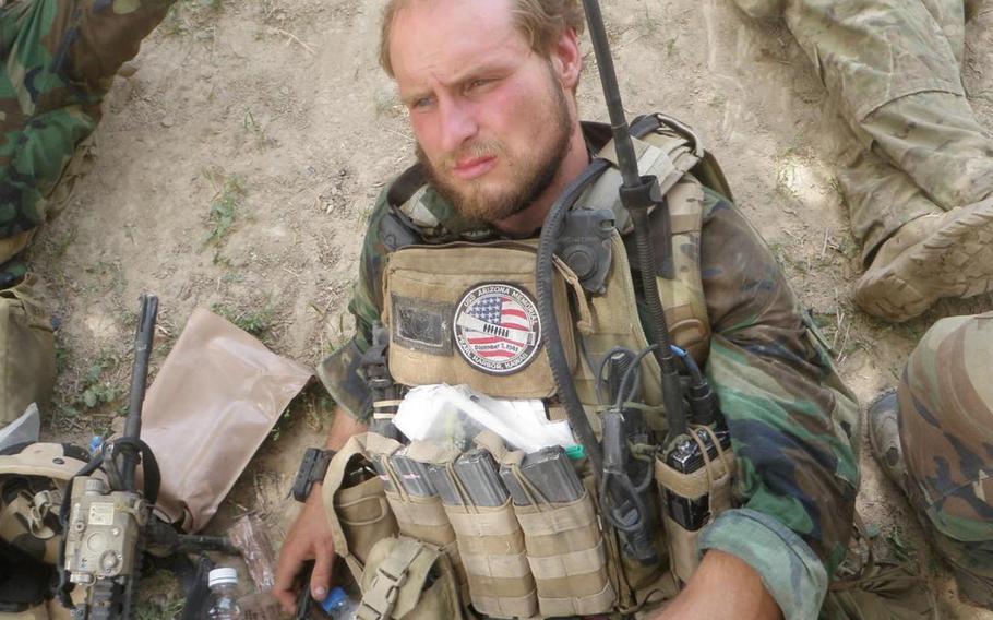 Green Beret Kevin Flike rests prior to a large Taliban attack on his unit in Faryab province in northern Afghanistan on May 13, 2011. Flike, 35, said he got perhaps one hour of sleep in the two-day gunfight that occurred after this photo was taken.