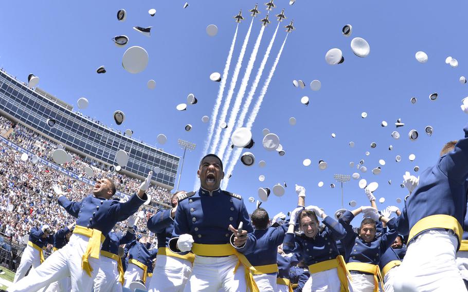 Newly-minted Air Force second lieutenants cheer and toss their hats at the end of the U.S. Air Force Academy's Class of 2017 graduation ceremony, May 24, 2017, at Falcon Stadium. 