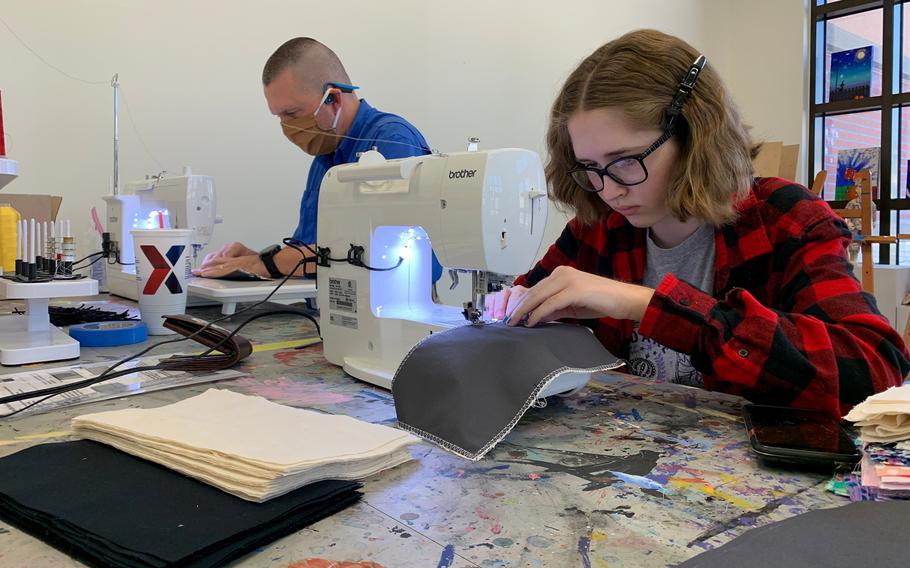 Craig Frank, 48, of Vermillion, S.D., teamed up with his daughter, Anastasia Frank, 16, to sew cloth masks as part of a volunteer initiative for the military community at Camp Humphreys, South Korea, Wednesday, April 8, 2020.