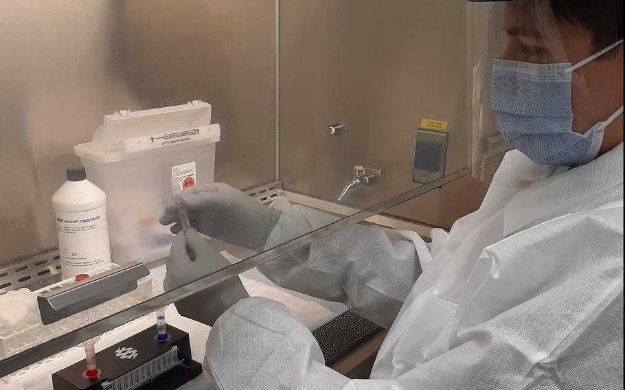 Sgt. Josue Caballero, noncommissioned officer in charge of the Vicenza Army Health Clinic laboratory, prepares specimen collections for the new coronavirus rapid testing system. The new diagnostic test for the coronavirus, which returns results in around an hour, is available at seven military clinics in Europe.