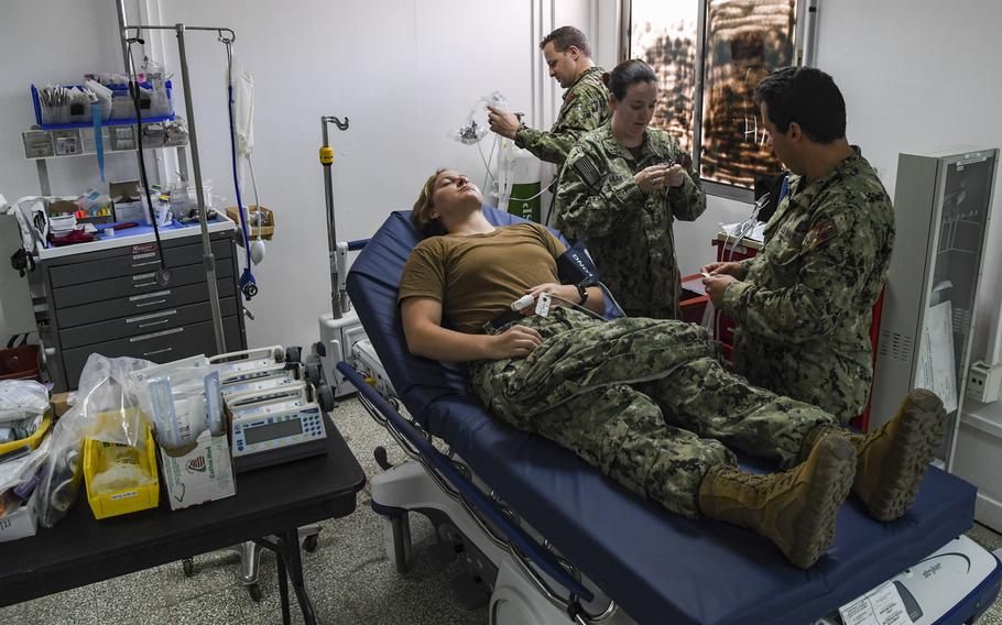 Staff from the Expeditionary Medical Facility demonstrate medical equipment used to stabilize patients at the COVID-19 Intensive Care Unit facility at Camp Lemonnier, Djibouti, April 9, 2020. The COVID-19 ICU is separate from the medical facility to prevent potential cross-contamination of the virus.