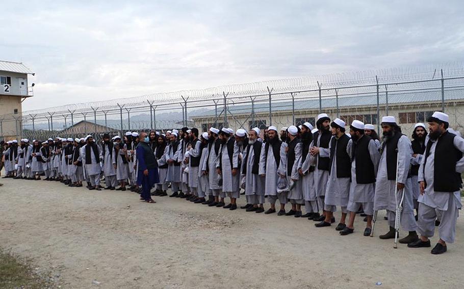 Taliban prisoners line up before being released by Afghan authorities in April 2020. The Taliban rejected calls from senior U.S. and Afghan officials for a cease-fire during the Muslim holy month of Ramadan, which started Thursday, April 23, 2020, until thousands more of its fighters have been released from government jails.