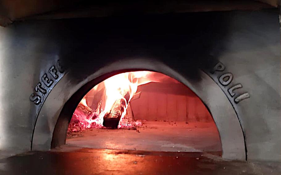 The wood-burning pizza oven at DoDo, Verace Pizza Napoletana in Sacile, Italy, is seen late last year, before the country shut down restaurants and most other businesses to fight the coronavirus. DoDo serves Neapolitan pizzas, prepared the way they have been for hundreds of years.
