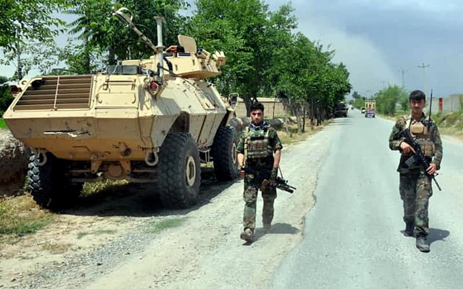 Afghan soldiers patrol a road in northern Kunduz province on Tuesday, May 19, 2020, after the country?s defense ministry said local forces were successful at repelling Taliban advances throughout the night.