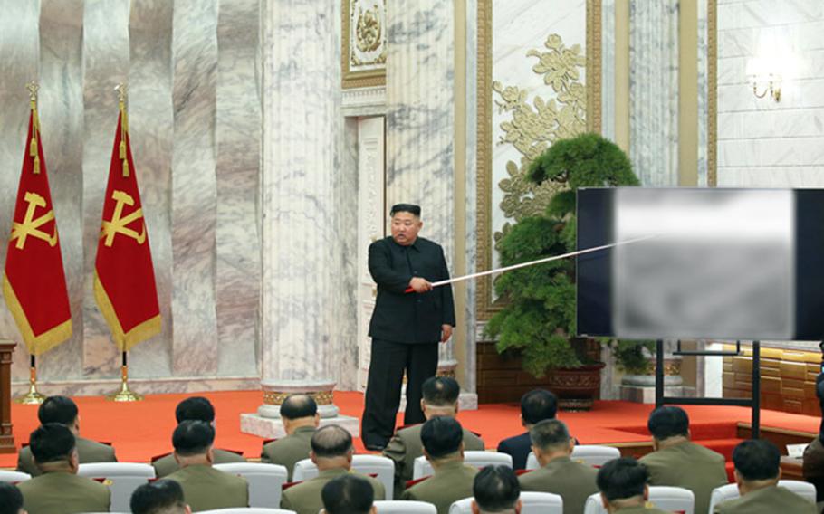 North Korean leader Kim Jong Un presides over a meeting of the central military commission of the ruling Workers' Party in this undated photo published by the Korean Central News Agency on Sunday, May 24, 2020.