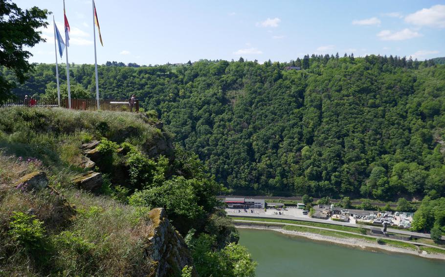 Visitors look down on the Rhine River from one of the viewing platforms on top of the Lorelei, near St. Goarshausen, Germany.