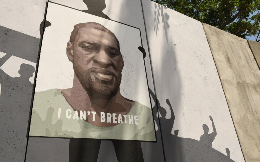 A mural to honor George Floyd, the African American man who died at the hands of police in Minnesota last month, adorns a blast wall near Kabul's Green Zone on June 15, 2020.