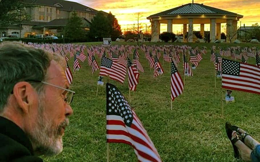 Howard Berry sits among rows of American flags. The ''Flags for Forgotten Soldiers'' initiative was a brainchild of  Berry, a Cincinnati, Ohio, man who lost his son, Army Staff Sgt. Joshua Berry, to suicide. Berry died last month after a battle with cancer.