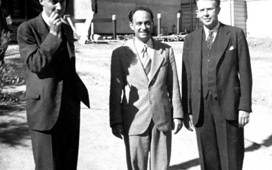 Pioneers of atomic science in the United States shown in this undated photograph are, from left, J. Robert Oppenheimer, Enrico Fermi and Ernest Lawrence.