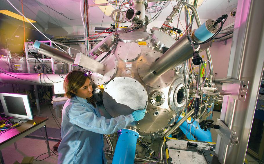 Doctoral student Despina Milathianak performs experiments at the Trident Laser Facility, Los Alamos National Laboratory, on Oct. 8, 2008. The laser can produce 500 times the electrical power output of the U.S. in 500 quadrillionths of a second.