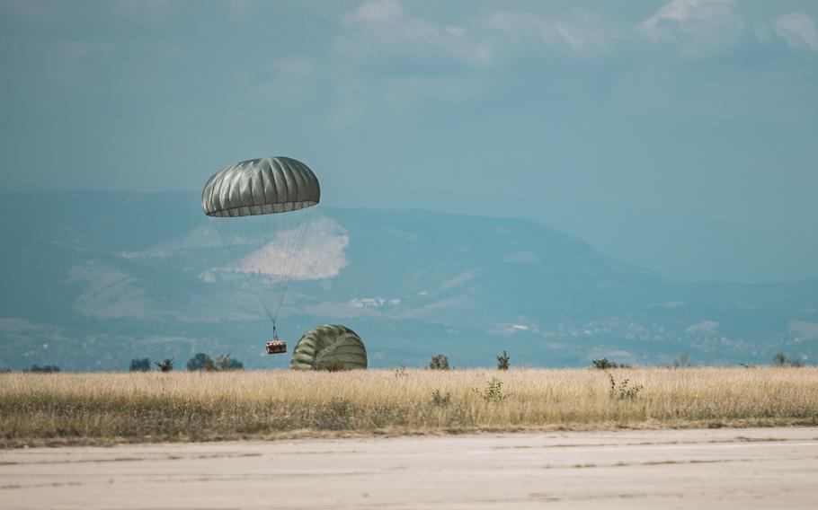 A container delivery system falls to the drop zone during exercise Thracian Summer at Cheshnegirovo landing zone, Bulgaria, Aug. 19, 2020.