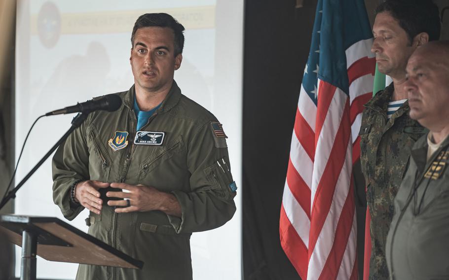U.S. Air Force Maj. Derek Andeweg, 37th Airlift Squadron aircraft instructor pilot, explains training operations to Bulgarian government officials and military members during the exercise Thracian Summer at Cheshnegirovo landing zone, Bulgaria, Aug. 19, 2020.
