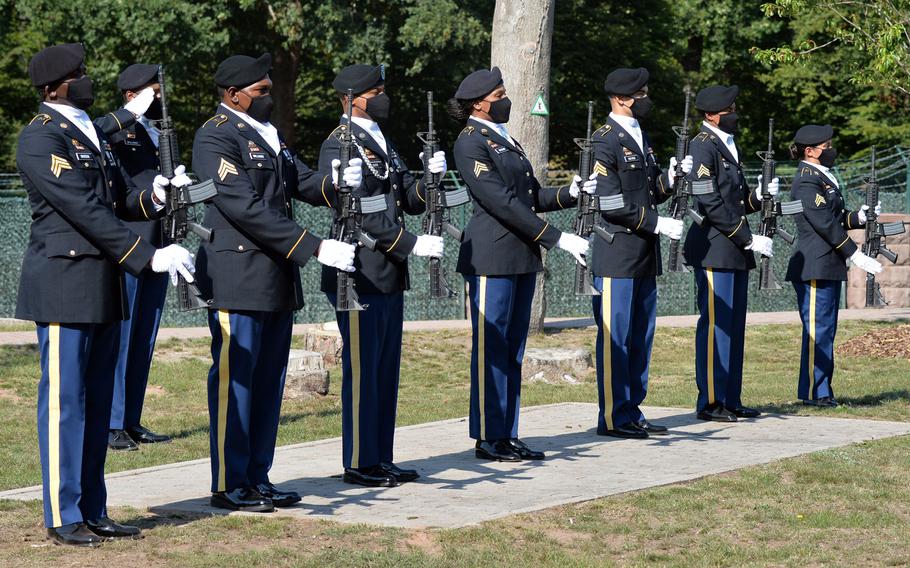 The firing detail stands at attention during the playing of taps at the  9/11  remembrance ceremony hosted by the 21st Theater Sustainment Command at Panzer Kaserne in Kaiserslautern, Germany, Sept. 11, 2020.
