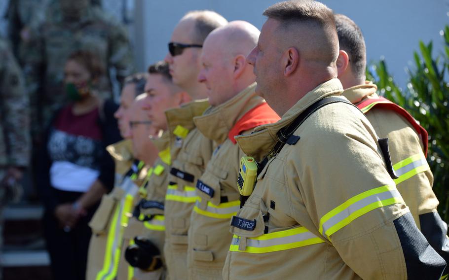 Members of the U.S. Army Garrison Rheinland-Pfalz fire department take part in the 9/11 remembrance  ceremony hosted by the 21st Theater Sustainment Command in Kaiserslautern, Germany, Sept. 11, 2020.