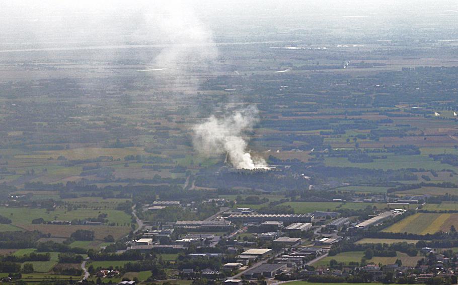 Smoke rises from a waste treatment plant about 6 miles from Aviano Air Base, Italy, on Sept. 20, 2020. Authorities on Friday lifted a warning to avoid touching grass and soil due to contamination fears from the fire, which burned for days.