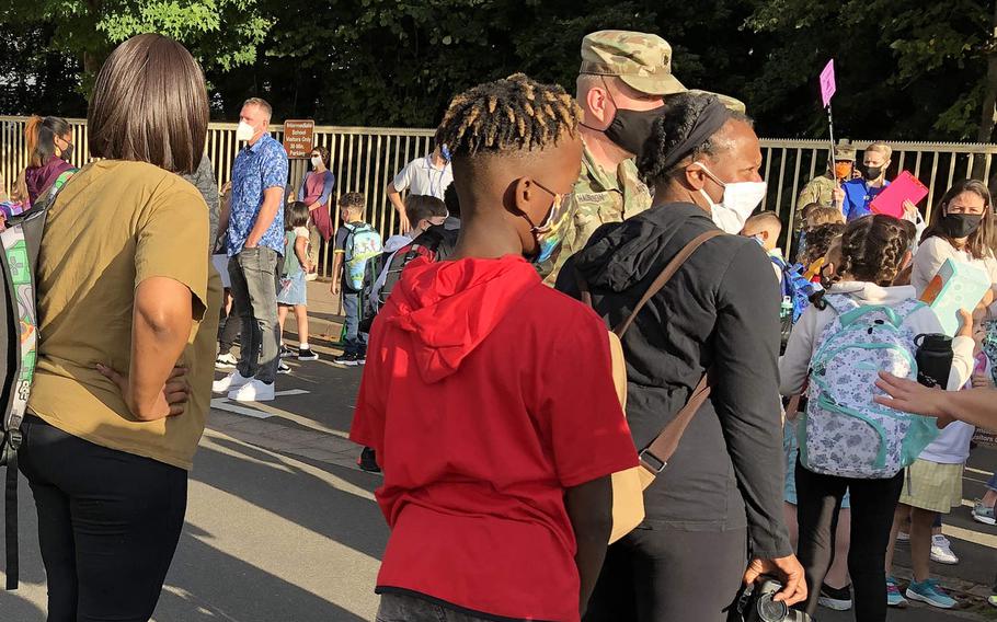 Ramstein Intermediate School students and parents lined up on the first day of school on Aug. 24, 2020, at Ramstein Air Base, Germany. The school announced Friday that it will close through Oct. 5 after three employees tested positive this week for coronavirus.
