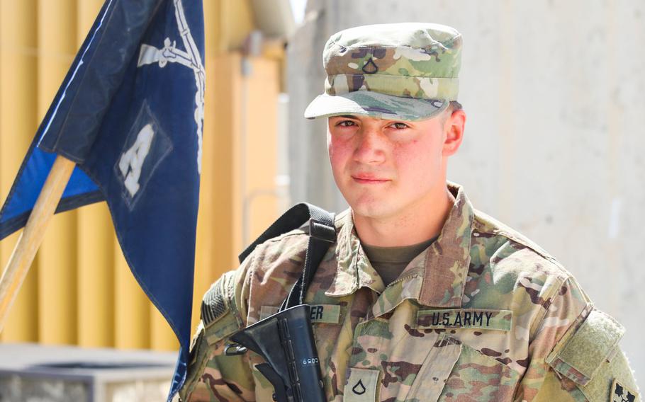Pfc. Trenton Kreuger, an infantryman with 2nd Infantry Brigade Combat Team, 4th Infantry Division, poses for a photo in Kandahar, Afghanistan. Kreuger's father Michael Kreuger also served in Afghanistan.