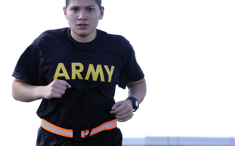 Sgt. Samantha Garcia stays focused on her breathing and pace as she runs during the Army Physical Fitness Test at the Greenlief Training Site, Neb., in 2017. The Army is surveying women in the force to help pick the best sports bras on the market to go into the standard clothing bag issue.