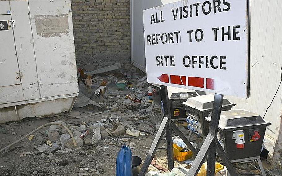 A sign that once stood at Kandahar Airfield now directs visitors to chickens at a local bazaar where goods from the base are sold to locals. Vendors at the "Bush Bazaar" in Kandahar said containers filled with generators, refrigerators and other valuable goods have been leaving the base as part of the ongoing drawdown of U.S. troops.