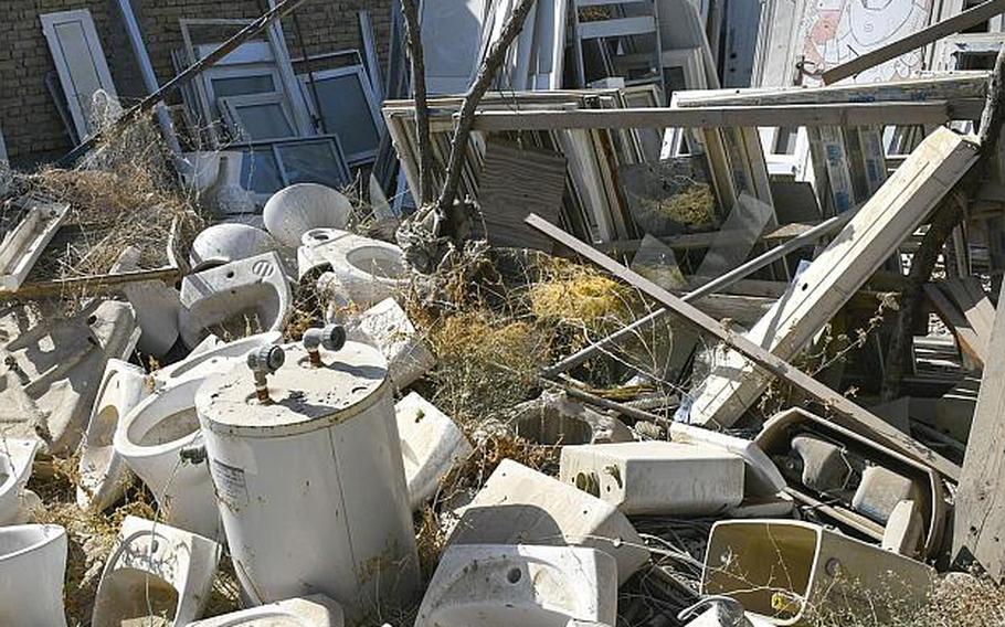 Sinks, toilets and water heaters are among items discarded by U.S. and NATO troops that were available for purchase by locals Saturday, Oct. 31, 2020, at a bazaar in Kandahar, Afghanistan.