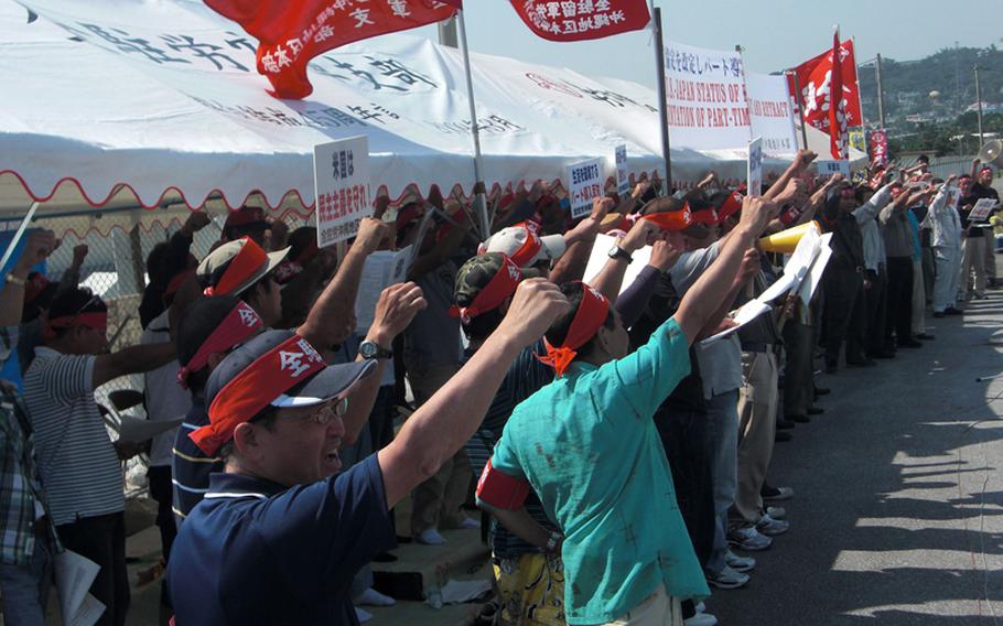 Members of the union that represents Japanese AAFES employees protest May 18, 2012, to demand that the exchanges scrap a plan to limit workers over age 60 to 30 hours a week. The union plans a strike 
                for July 13 that will force some AAFES facilities on Okinawa to close or reduce operating hours.
                