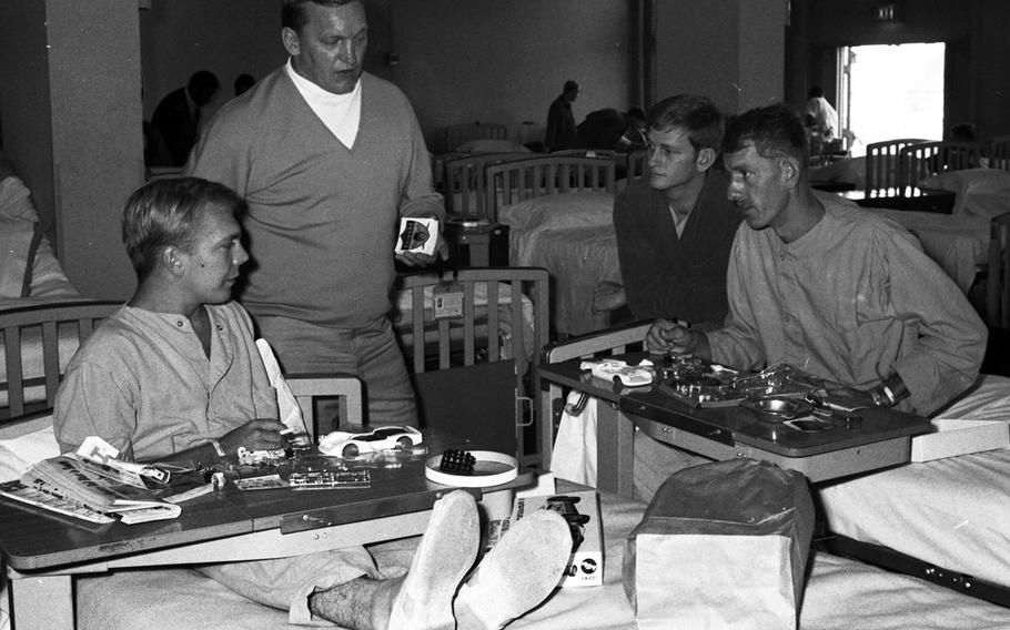 Jim Otto talks with patients at the U.S. Army Hospital on Camp Oji, Japan, in January, 1969.