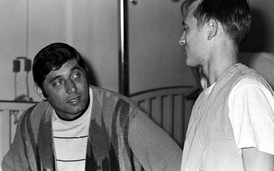 Joe Namath talks with a patient at the U.S. Army Hospital on Camp Oji, Japan, in January, 1969.