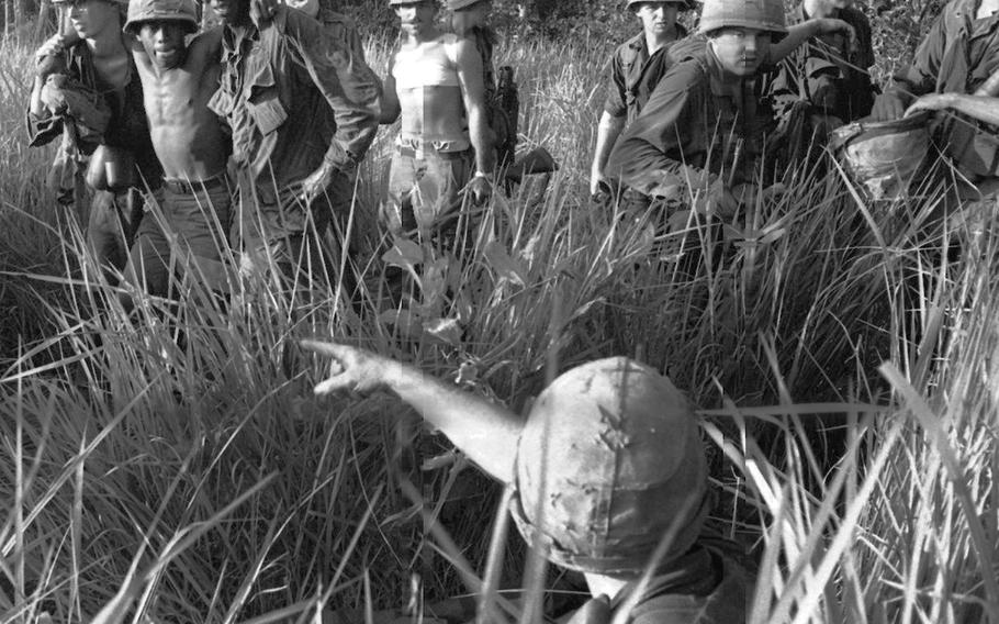 Wounded soldiers are evacuated from an area near Dau Tieng, Vietnam, in November, 1966.