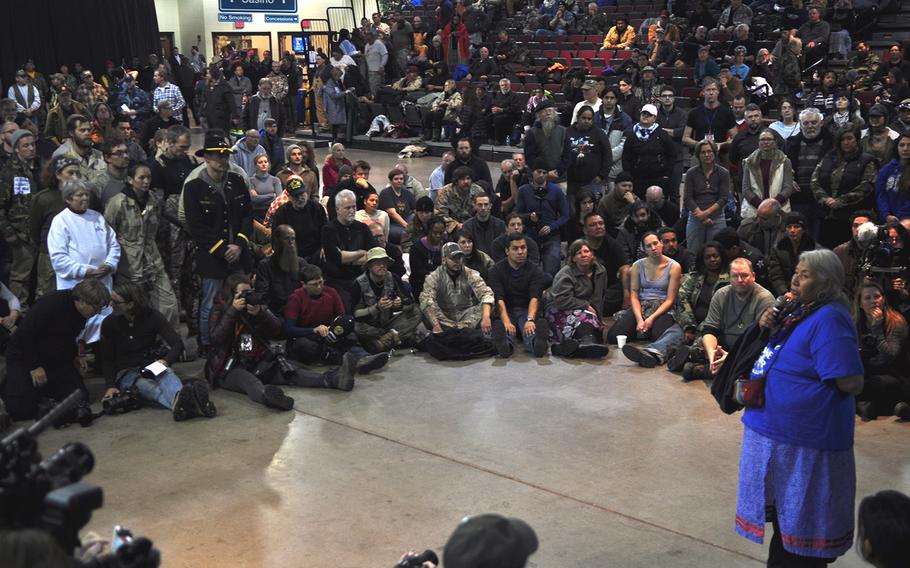 Tribal elder Faith Two Eagles addresses several hundred veterans inside Prairie Knights Casino and Resort on Monday, Dec. 5, 2016. The gathering wrapped up the veterans' visit to Standing Rock. 