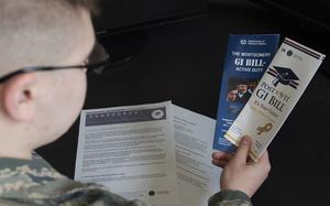 Airman Dalton Shank, 5th Bomb Wing public affairs specialist, reads pamphlets on the Montgomery GI Bill and the Post-9/11 GI Bill at Minot Air Force Base, N.D., March 10, 2017. A higher education can be achieved with little to no cost by utilizing the services offered through the Air Force. (U.S. Air Force photo/Airman 1st Class Alyssa M. Akers)