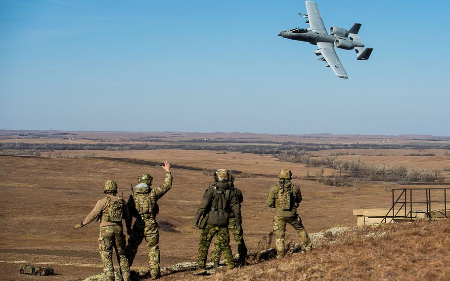 Members of the 146th Air Support Operations Squadron, from Oklahoma City, and Estonian tactical air control party specialists acknowledge a 442nd Fighter Wing A-10 Thunderbolt II from Whiteman Air Force Base, Missouri on Dec. 13, 2017.