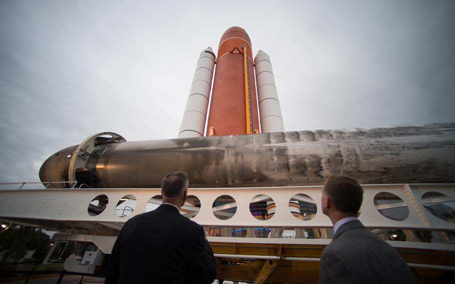 U.S. Marine Corps Gen. Joe Dunford, chairman of the Joint Chiefs of Staff, views one of SpaceX's two Falcon Heavy rocket boosters while attending a reception before the 2nd National Space Council meeting at the John F. Kennedy Space Center, Florida, Feb. 20, 2018.