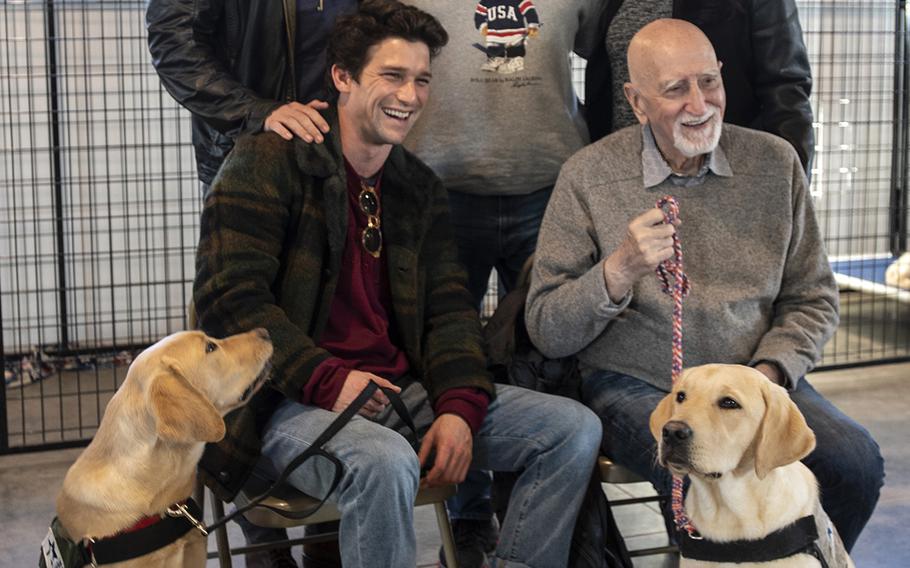 Cast of the new TV show "The Village" visit Warrior Canine Connection in Boyds, Maryland, on November 10, 2018, to learn about service dogs and their role helping veterans. The show will air in 2019. From top left: actor Warren Christie, military consultant Jamel Daniels, executive producer Jessica Rhoades, actor Daren Kagasoff and actor Dominic Chianese. (Meredith Tibbetts/Stars and Stripes)