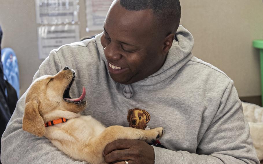 Military consultant Jamel Daniels, part of the cast of the new TV show "The Village" visit Warrior Canine Connection in Boyds, Maryland, on November 10, 2018, to learn about service dogs and their role helping veterans. The show will air in 2019. 