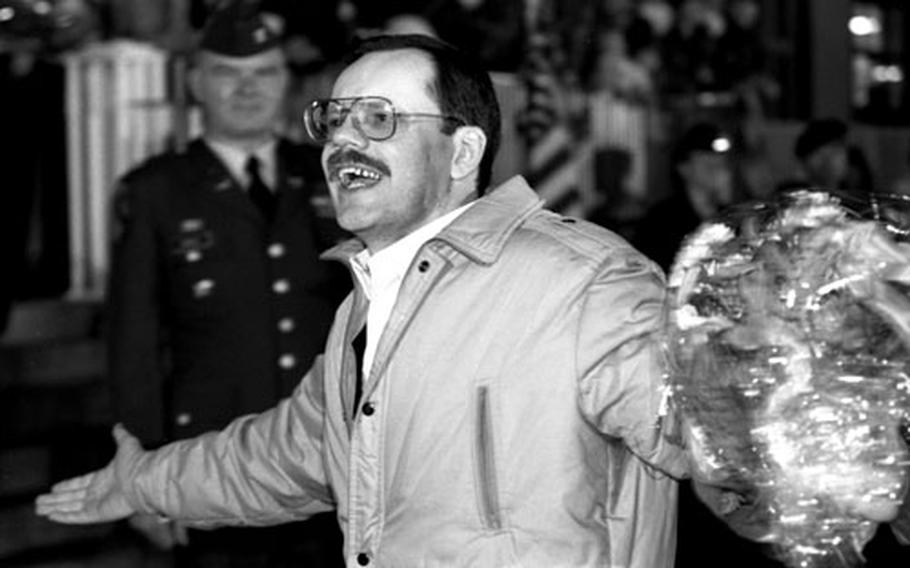 Terry Anderson acknowledges the cheers of the crowd that greeted him upon his arrival at Wiesbaden.